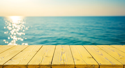 Wood table top with blurred sparkling sea water and bright summer sky background. Tropical beach concept