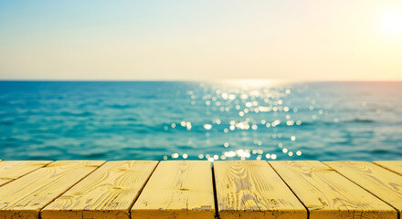 Wood table top with blurred sparkling sea water and bright summer sky background. Tropical beach concept
