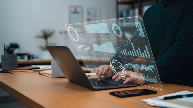 Analyzing data on laptop with hud interface for business intelligence and financial analysis task