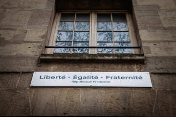 French motto Liberte Égalite Fraternite, Liberty Equality Fraternity, with Republique Française, french republic, on a public building in Paris, a symbol of the french state in france.
