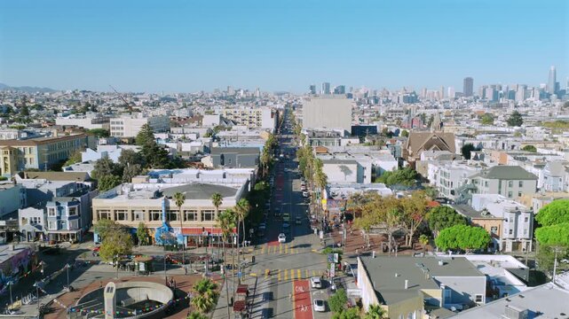 San Francisco - Aerial View of Mission St and 16th Ave in Mission District with stores cars buses 