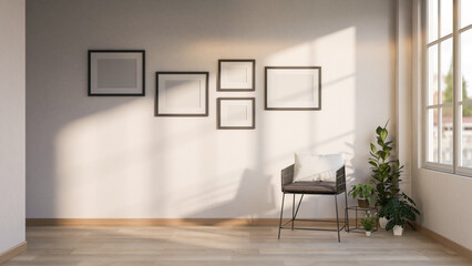 Blank black frames on wall over metal chair and houseplant pot on wooden parquet floor under window.