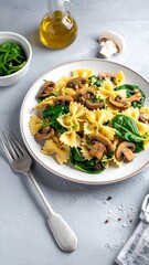 Pasta dish with mushrooms, spinach, and olive oil