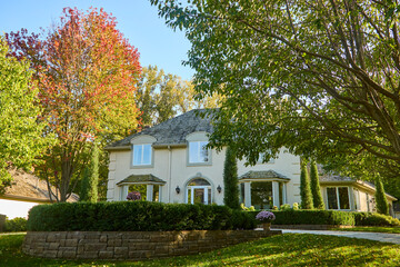 Exterior of modern home on a fall day with leaves starting to change color