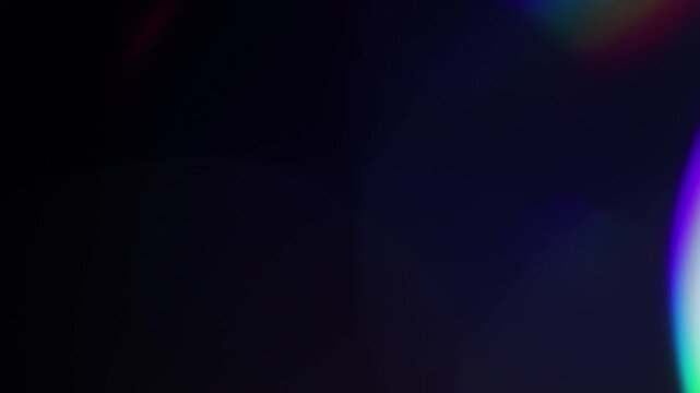 Multicolored light leaks footage on black background, lens flare leak burst overlays transitions new organic