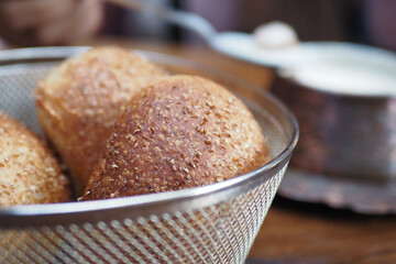 Freshly baked rolls served in a rustic basket