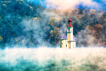 霧の中にたたずむヨーロッパ風教会合成