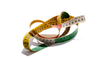 Coiled, colorful tailor's measuring tape, used for sewing, crafting, and body measurements, isolated on a white background. Concept of accuracy, tailor, dressmaking, and precision.