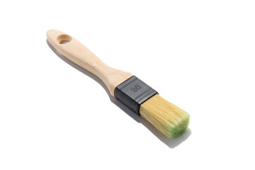 Clean paint brush with a wooden handle and natural bristles, isolated on a white background. Essential tool for painting, crafting, DIY projects, and artistic work.