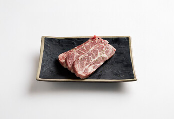 raw pork belly on a plate