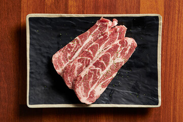 raw pork belly on a plate