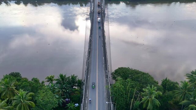 Tilt up view of the Macapagal Bridge crossing the Agusan River in Butuan Philippines. 