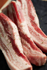 raw pork belly on a plate