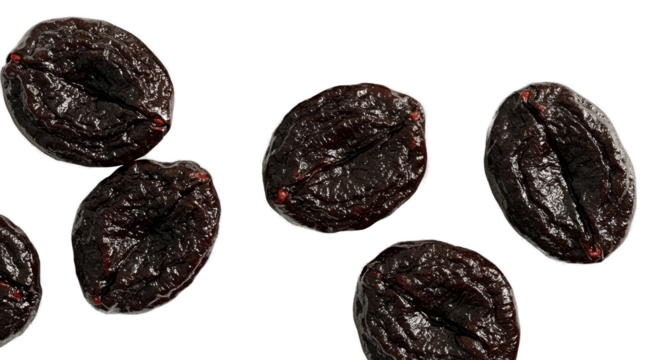 Dried Prunes Scattered on a Dark Surface Realistic Photo