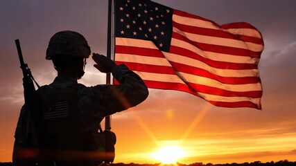Soldier Saluting American Flag at Sunset - A silhouette of a US soldier salutes the American flag against a vibrant sunset. The video evokes feelings of patriotism, remembrance, and national pride.