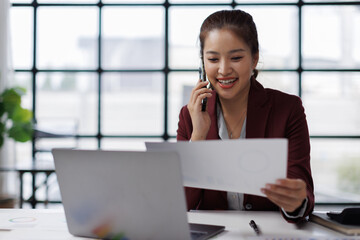 Office, business asian woman and laptop with phone call for communication, financial help or bank...