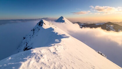 Snowy mountain peaks emerge from clouds, bathed in golden sunlight