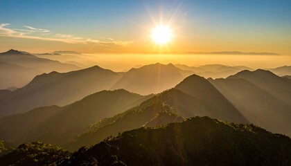 Scenic mountaintops bathed in golden sunlight at dawn