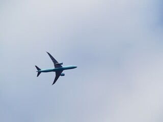Airplane Flying in Cloudy Sky Over Ottawa, Canada