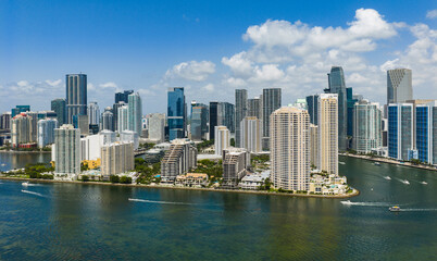 Obraz premium Aerial view of Brickell skyscrapers. Modern cityscape of downtown Miami. Panoramic Miamis skyline above the coastline. Brickell Key aerial view in Miami. Landscape of Miami. Miami Beach and Brickell.