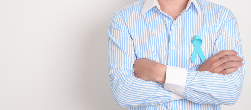 man with blue Ribbon for concept of blue November, November Prostate Cancer Awareness month, World Diabetes day , Men Health month, International men, Father day. Healthcare and world cancer day - Powered by Adobe