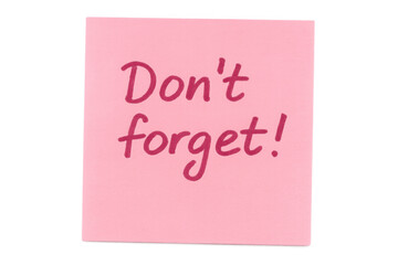 Pink sticky note with don't forget! reminder message, handwriting, schedule planning, task organization