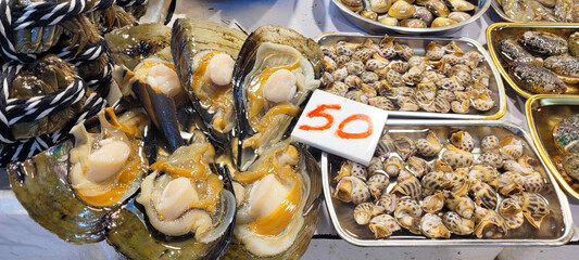 Selection of raw seafood products displayed in a local market.