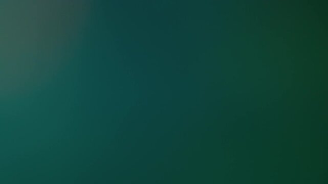 Blur gradient spectrum. Retro lens prism. Green blue defocused light fading glowing on dark background. Old film twinkling spot beam transition.