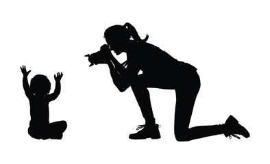 Woman with camera taking pictures of child baby boy black silhouette vector illustration on white background.