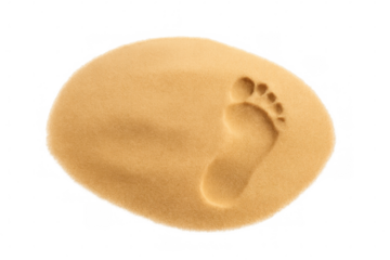 Human footprint leaving mark in sand, representing travel, journey, vacation, discovery, and path