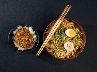Savor the authentic flavors of Asia with this enticing ramen and rice dish. Perfect for restaurant menus, food blogs, or showcasing delicious cuisine.