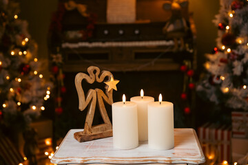 Christmas candles, blurred bokeh lights on the background.