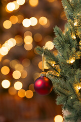 Close up of balls on christmas tree. Bokeh garlands in the background. New Year concept.