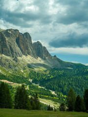 Spectacular view of Seceda ridgeline in the Dolomites, Italy. Dramatic limestone peaks rising above vibrant green slopes under a bright summer sky &mdash; a breathtaking natural masterpiece.