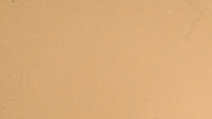 Background of brown kraft paper or cardboard texture. Abstract pattern of beige rough carton, old paper sheet, 
