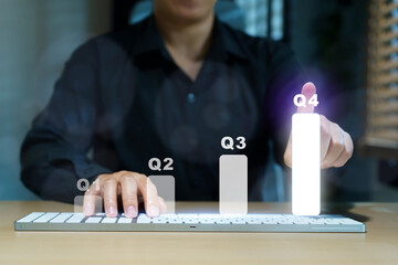 Woman in interacts with holographic quarterly business growth.