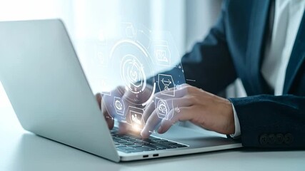 Businessman interacting with a futuristic holographic interface on a laptop for data analysis, business intelligence, and digital strategy - Powered by Adobe