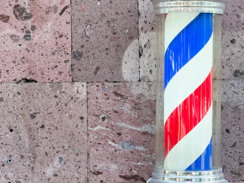 Classic Vintage Barbershop Spinning Barber Pole Red and Blue Striped Helix Sign. High quality photo