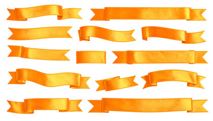 Obraz premium Collection of golden, fluttering ribbons against a stark black background, ideal for decorative purposes