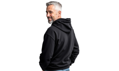 Rear view of a handsome mature man in a black hoodie looking back at the camera with a friendly smile, isolated on transparent background