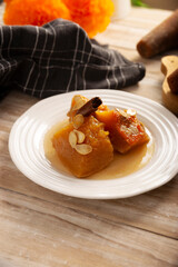 Calabaza en Tacha. Spiced Candied Pumpkin. Mexican dessert whose main ingredients are pumpkin and piloncillo, also known as Chacualole or Dulce de Calabaza, widely used in Day of the Dead offerings.
