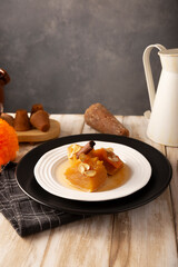 Calabaza en Tacha. Spiced Candied Pumpkin. Mexican dessert whose main ingredients are pumpkin and piloncillo, also known as Chacualole or Dulce de Calabaza, widely used in Day of the Dead offerings.
