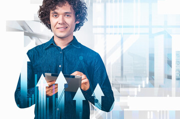 Smiling man holding tablet with upward arrows and graph overlay, modern graphic style, bright office background, concept of business growth and success