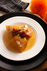 Calabaza en Tacha. Spiced Candied Pumpkin. Mexican dessert whose main ingredients are pumpkin and piloncillo, also known as Chacualole or Dulce de Calabaza, widely used in Day of the Dead offerings.