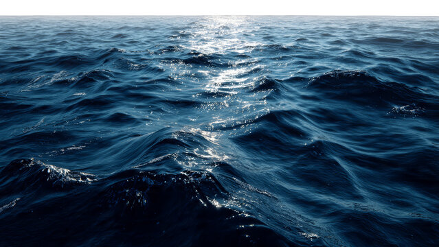 Deep blue ocean waves with sunlight glistening on the water's surface create a textured atmospheric seascape isolate