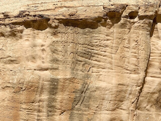 Fototapeta premium Petra, the ancient city and archaeological site in southern Jordan. Writings on the tomb along the trail from visitor center to Obelisk tomb and Bab el-Siq Triclinium