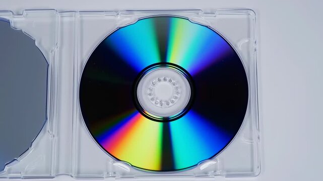 A colorful optical disc in a clear plastic case