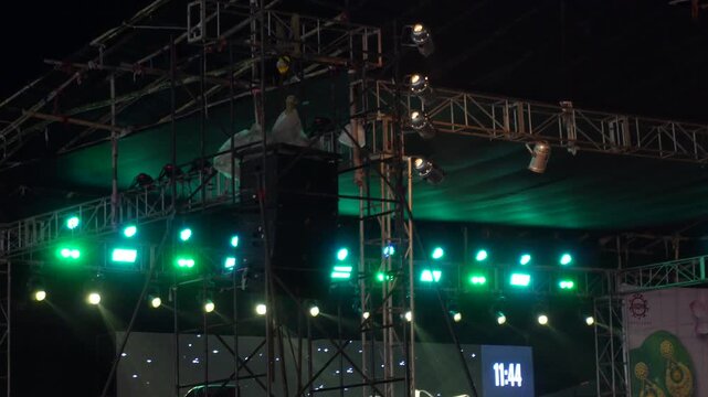 live music event or concert stage lighting rig at night