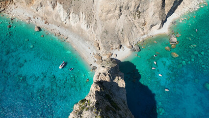 Aerial drone photo of paradise volcanic island white cliffs with limestone trees forming sea caves...