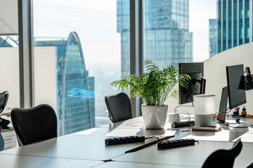 A workplace for managers or IT programmers with a view of the skyscrapers in the business center